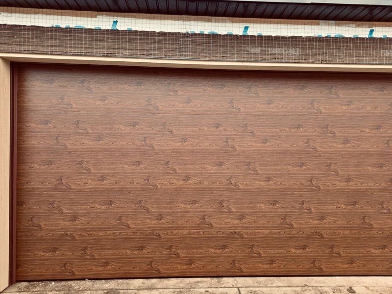 Close-up of a wood-grain finish garage door